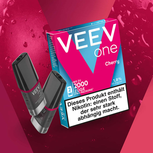 VEEV ONE Pods Cherry mit zwei Pods und Verpackung vor pinkem Hintergrund